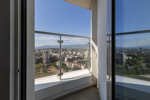 a window with a view of a city at 20th Floor Amazing View, Spa & Fitness Parking APT in Skopje