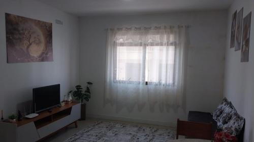 Μια τηλεόραση ή/και κέντρο ψυχαγωγίας στο Apt a 500m da praia do forte