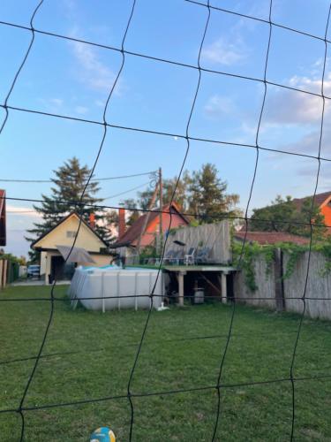 a soccer ball is in the net of a yard at Vikendica Mir Čortanovci in Čortanovci