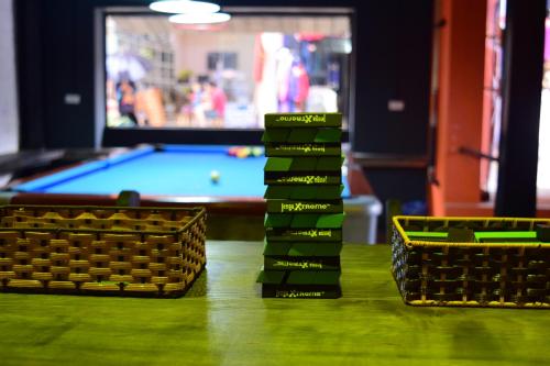 a table with two baskets and a pool table at Phuong Nam Hotel in Sa Pa