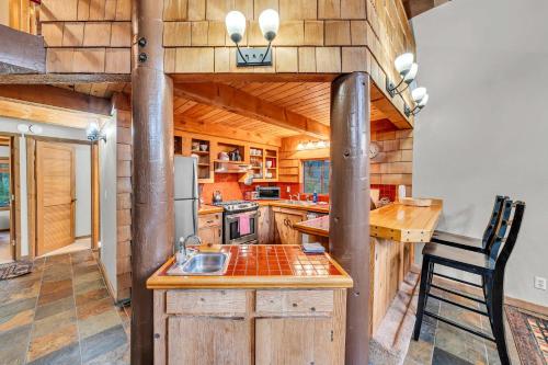 a kitchen with a sink and a stove at Peaceful Getaway Pet Friendly with Hot Tub and Grill in Tahoe City