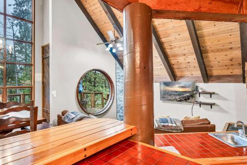 a living room with a sink and a mirror at Peaceful Getaway Pet Friendly with Hot Tub and Grill in Tahoe City