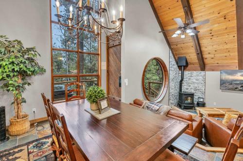 a dining room with a large wooden table and chairs at Peaceful Getaway Pet Friendly with Hot Tub and Grill in Tahoe City