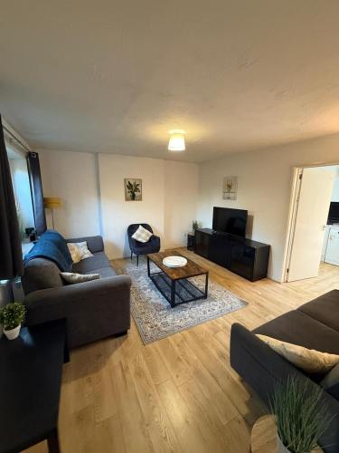 a living room with a couch and a table at Relaxing Home in Bradley Stoke in Bristol