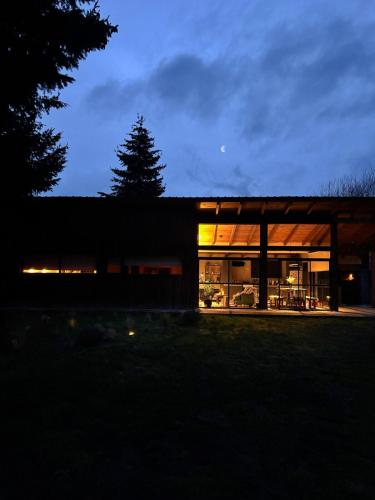 a house is lit up at night at Rest in the mountains in El Bolsón
