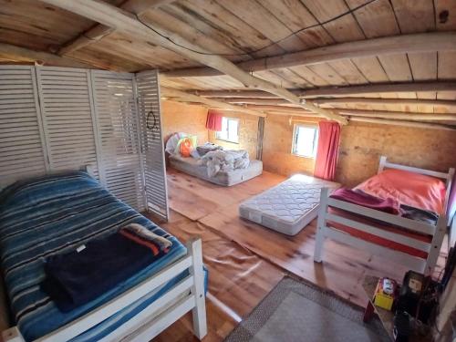 an overhead view of a room in a log cabin at El Rancho de Marcela in Cabo Polonio