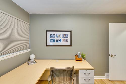 a room with a wooden desk and a white refrigerator at Near Dtwn Harrisburg Stylish Home with Patio and Yard in Camp Hill