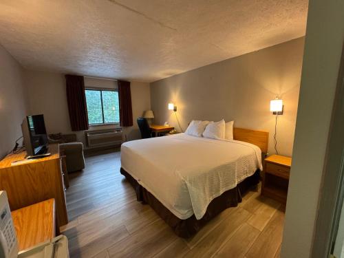 Ένα ή περισσότερα κρεβάτια σε δωμάτιο στο Days Inn by Wyndham Farmer City