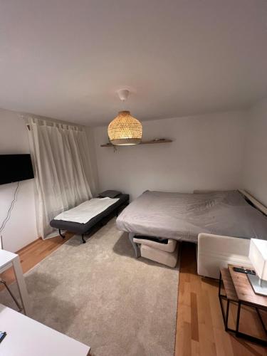 En eller flere senge i et værelse på Central Home