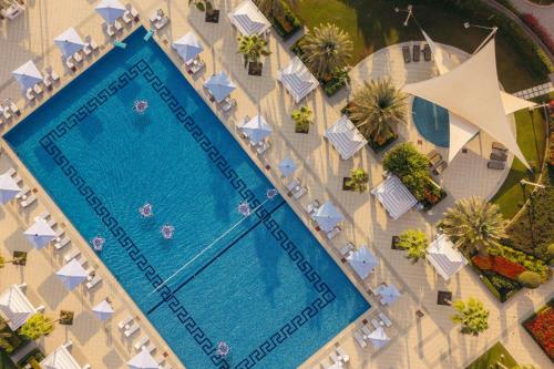 an overhead view of a swimming pool at a resort at The St. Regis Doha in Doha