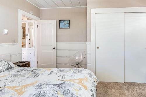 a bedroom with a bed and a chair at Miracle Mile Stay Classic Stockton Home with Yard! in Stockton