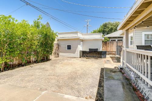 an empty driveway in front of a house at Miracle Mile Stay Classic Stockton Home with Yard! in Stockton