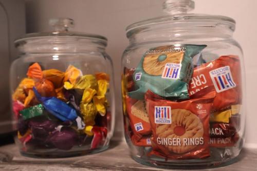 two glass jars filled with different types of candy at Chalfont Haven 