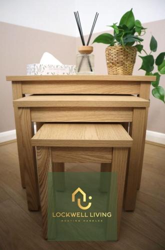 a small wooden table with a plant on it at Chalfont Haven 