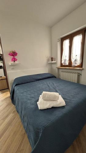 Postel nebo postele na pokoji v ubytování La casetta di Minerva