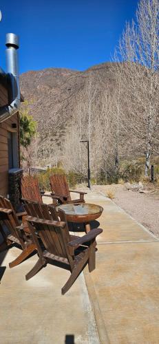 a picnic table and chairs sitting on a patio at Entre Montañas - Vista Calma in Potrerillos