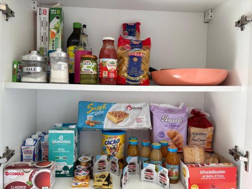 a refrigerator filled with lots of food and drinks at Ottaviano B&B con cucina in Reggio Calabria
