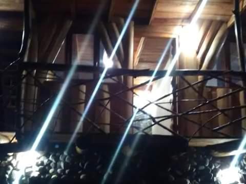 a room with lights on the side of a building at Glamping Machupicchu Lodge in Santa Teresa