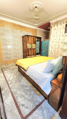 a bedroom with a large bed in a room at 3 Bedroom Apartment - Shri Amarnath Yatra baseCamp in Jammu