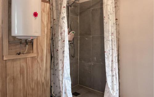 a bathroom with a shower with a shower curtain at 2 Bedroom Awesome Home In Højer in Højer