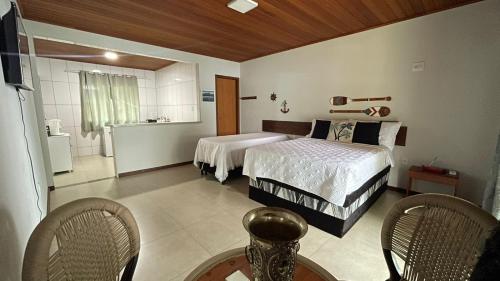 Ένα ή περισσότερα κρεβάτια σε δωμάτιο στο Encanto do Mar