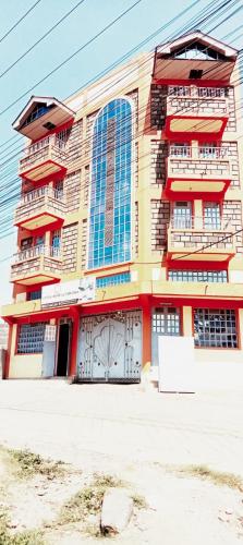 a large building with balconies on the side of it at Cherika Hotel & Lodgings in Nakuru