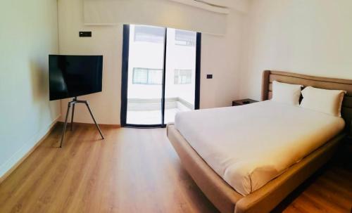 Postel nebo postele na pokoji v ubytování Magnifique appartement à Founty Agadir