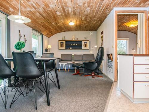 a dining room with a table and chairs in a room at 4 person holiday home in Grindsted-By Traum in Grindsted