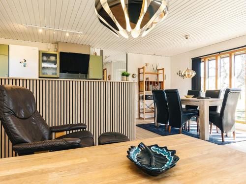 a room with a table and chairs and a dining room at 6 person holiday home in Læsø in Læsø