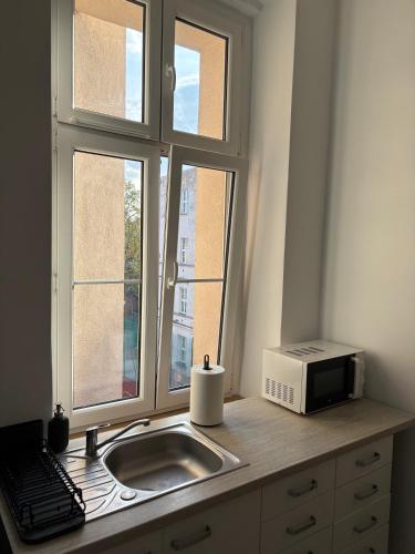 Η κουζίνα ή μικρή κουζίνα στο Kamienica Hostel