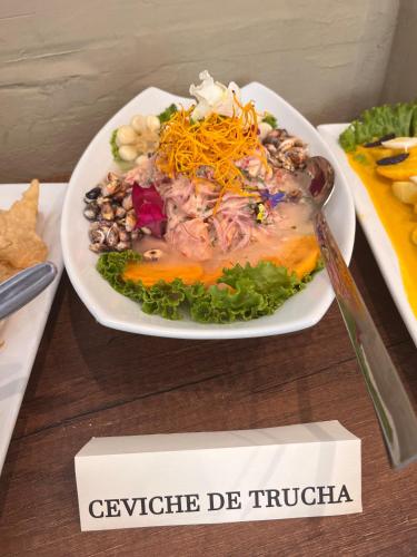 a plate of food sitting on top of a table at Velvet Sunrise Hotel in Machu Picchu