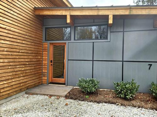 a house with a garage with a door at Piedmont Grove Lodging in Roseland