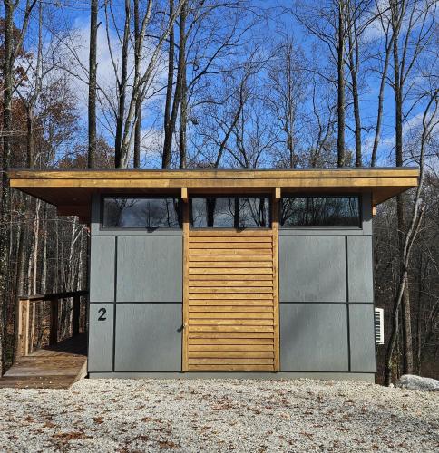 a garage with two garage doors and a wooden roof at Piedmont Grove Lodging in Roseland