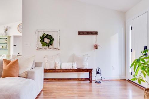 a living room with a couch and a table at Red Juniper Retreat 