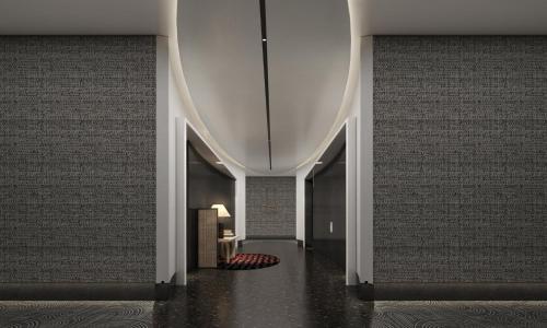 a hallway of a building with a white ceiling at HUALUXE Shenzhen Bao'an in Shenzhen