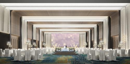 an image of a banquet hall with white chairs and a fountain at HUALUXE Shenzhen Bao'an in Shenzhen