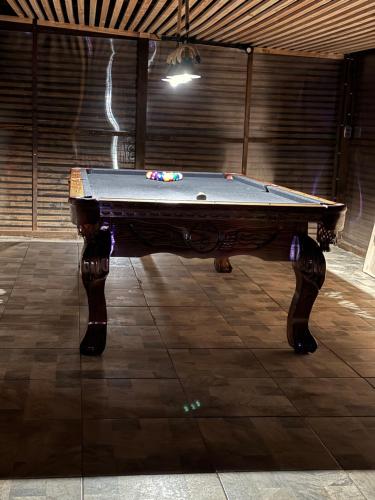 a pool table sitting on top of a floor at Cabaña de Ocaso in Los Ranchones