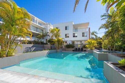 an image of a swimming pool in front of a building at Waterline 102 in Forster