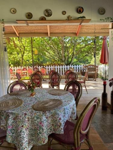 a table and chairs on a patio with a table at Jicote cabañas in Paraíso