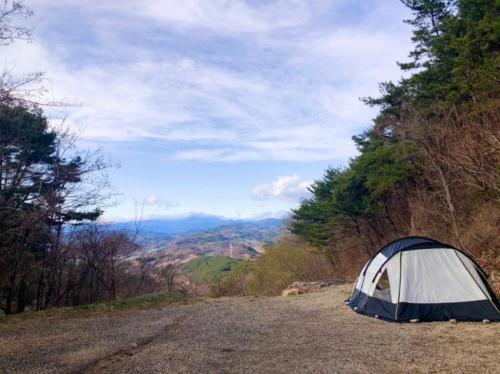 a tent sitting on the side of a dirt road at Venetian Terra KM LAND VTKL 하동 금오산 랜드 숲 캠핑장 