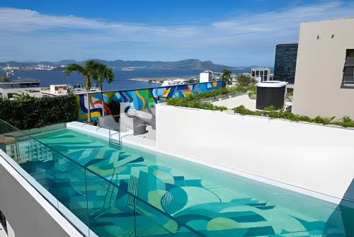 a swimming pool on the roof of a building at Skylux 702 in Rio de Janeiro
