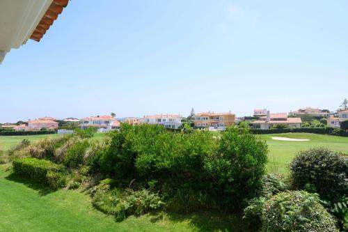 a view of a golf course with houses and trees at Praia D'El Rey Marriott Golf & Beach Resort in Casal da Lagoa Seca