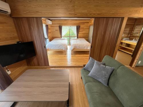 Ένα ή περισσότερα κρεβάτια σε δωμάτιο στο 湯布院 温泉付きの貸切別荘 無料Wi-Fi 無料駐車場