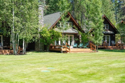 a house with a large yard in front of it at Metolius Cabin 5 in Camp Sherman