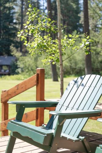 a white chair sitting next to a picnic table at Metolius Cabin 5 in Camp Sherman