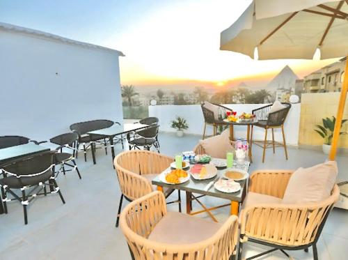 Imagem da galeria de Lodge Pyramids View Hotel em Cairo