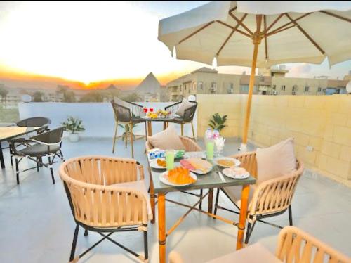 Imagem da galeria de Lodge Pyramids View Hotel em Cairo