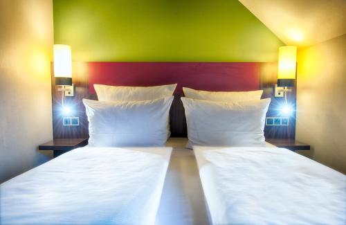 Katil atau katil-katil dalam bilik di Leonardo Hotel & Residenz Muenchen
