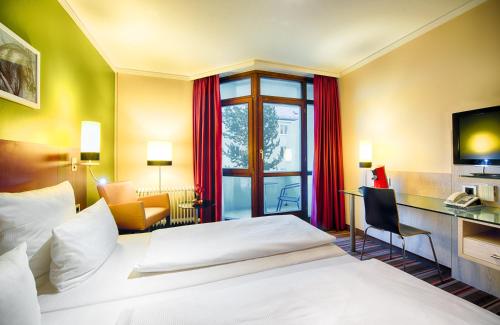 Katil atau katil-katil dalam bilik di Leonardo Hotel & Residenz Muenchen