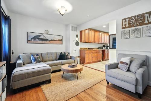 a living room with two couches and a table at House in Arlington 5 Min to DC in Arlington